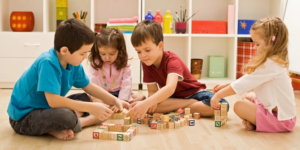 a group of children playing with blocks